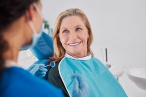 Happy patient smiling at her dentist